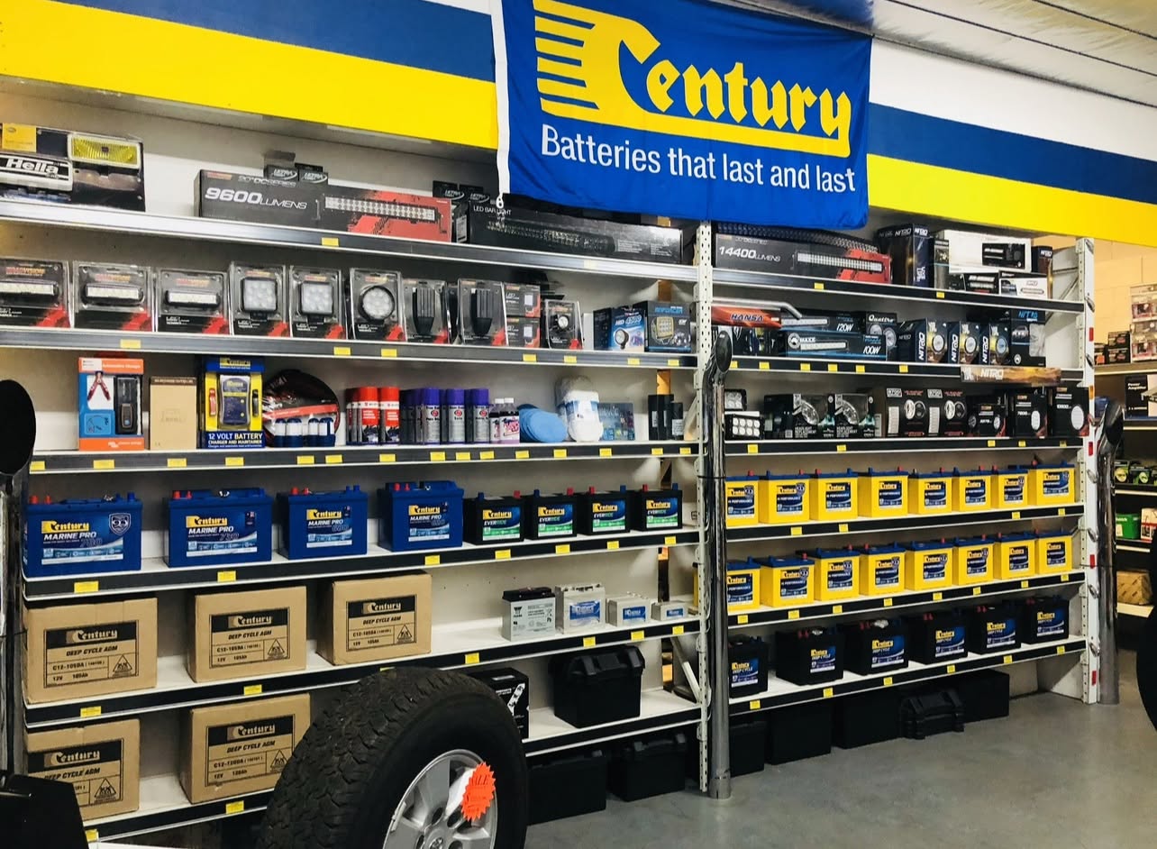 Battery shelving under the Century Batteries sign in the Tumut shop