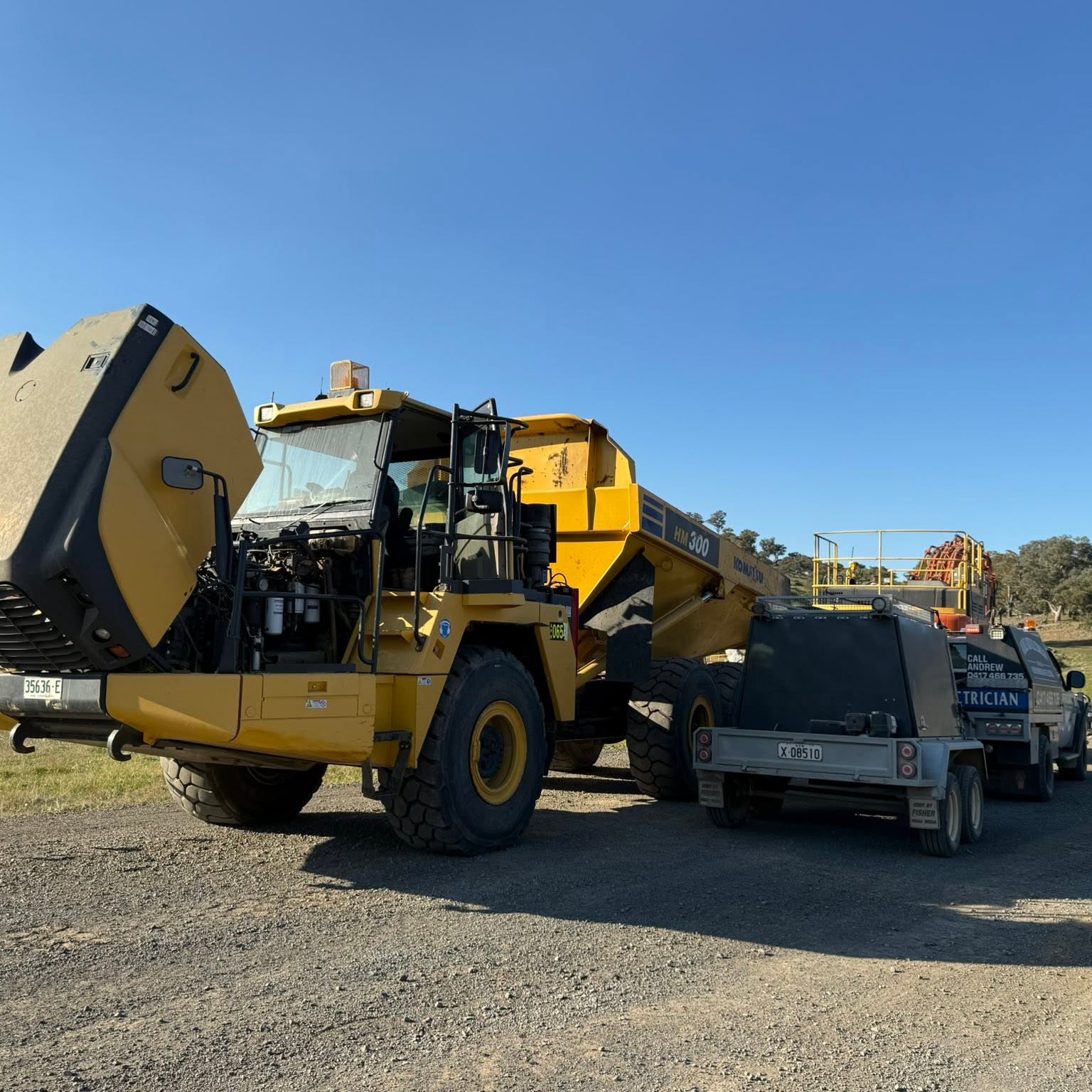 A wheel loader and dump trailer on a worksite near Tumut